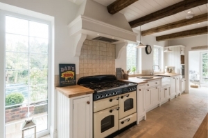 Traditional range cooker, wooden bespoke kitchen, wooden ceiling, oak beams