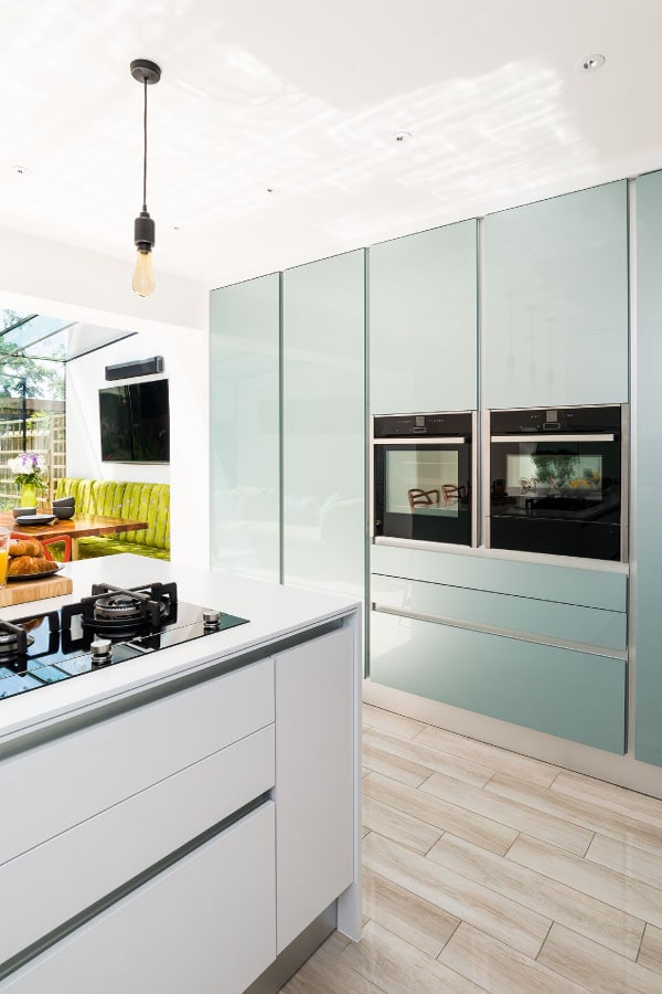 Bespoke luxury stylish kitchen, frame less glass box extension, Jacuzzi, moss wall