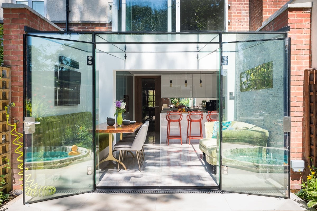 Bespoke luxury stylish kitchen, frame less glass box extension, Jacuzzi, moss wall