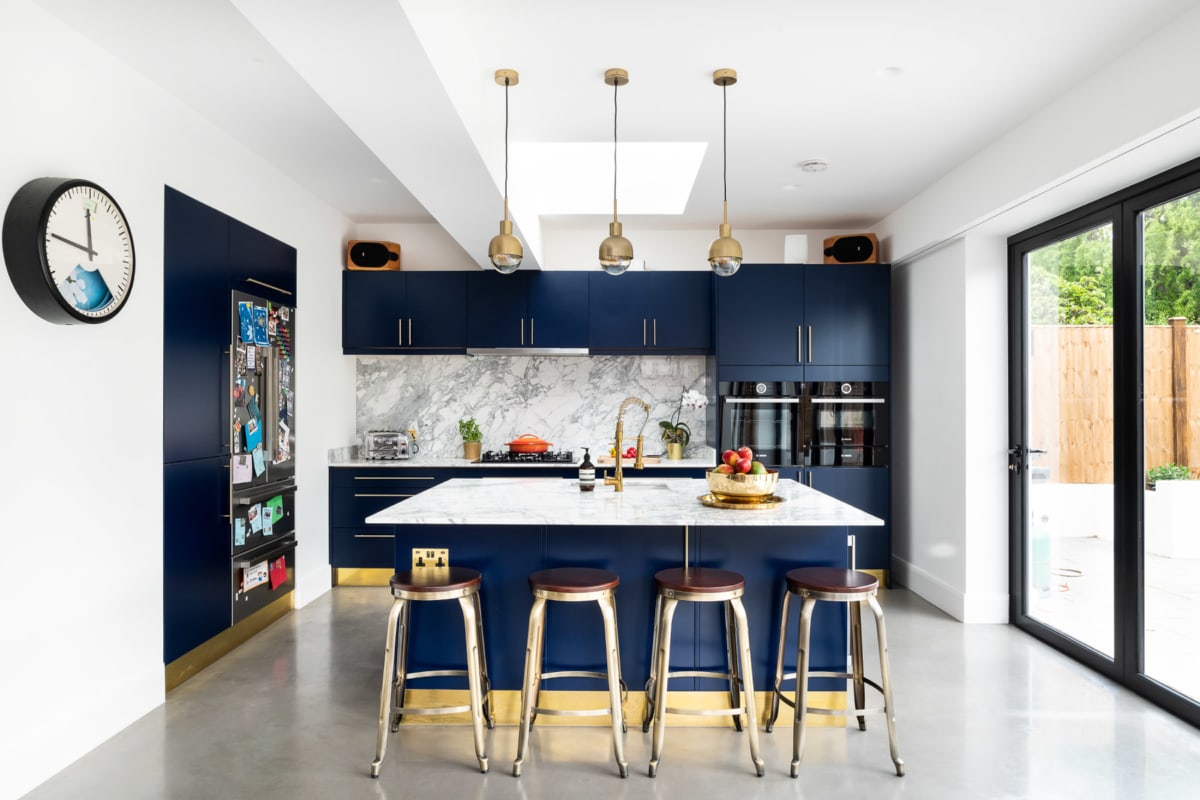 navy kitchen, polished concrete, brass fittings, marble