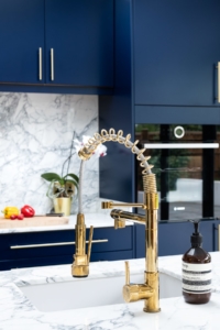 navy kitchen, polished concrete, brass fittings, marble